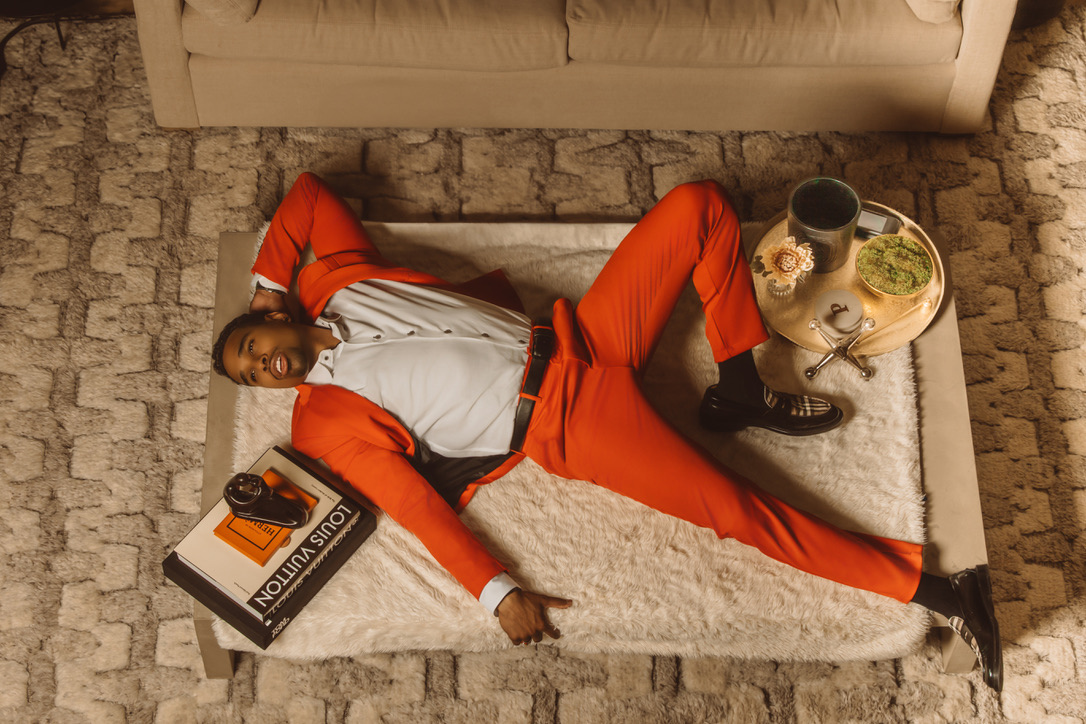 Overhead fashion portrait in a red suit